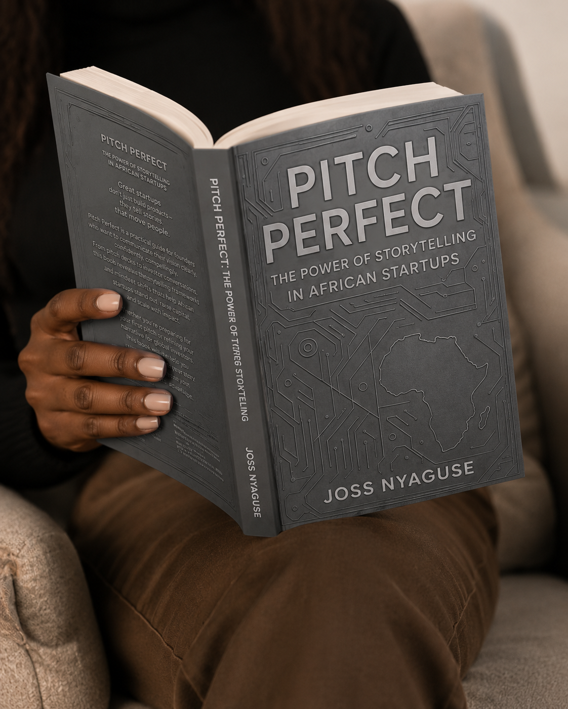 A reader holding Pitch Perfect by Joss Nyaguse
